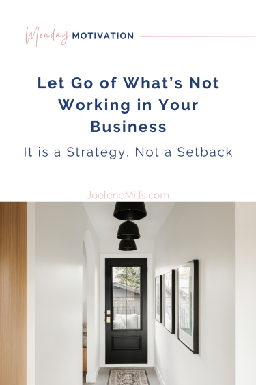 Hallway with black door and minimalist design, symbolizing clarity and permission to let go in business for introverted entrepreneurs.