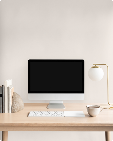 Clean home office setup with desktop computer, showing simple website essentials that support blogging without extra noise.