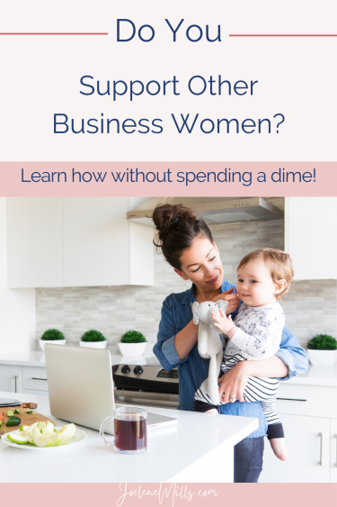 Business woman holding her baby with her laptop and coffee on the kitchen island with the words "do you support other business women? Learn how without spending a dime"