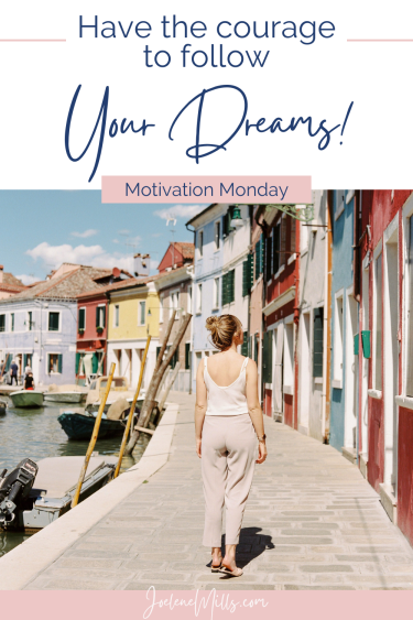 A woman walking along a colourful boardwalk with the words have the courage to follow your dreams above her