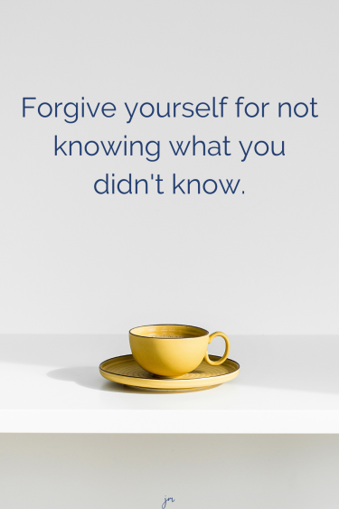 yellow coffee cup and saucer on a white table with the words "Forgive yourself for not knowing what you didn't know"