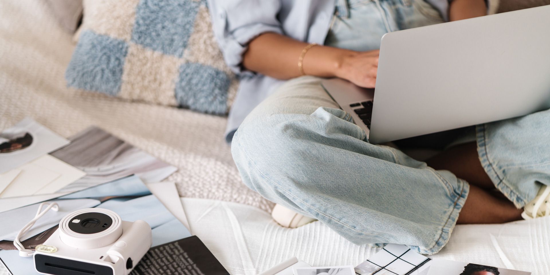 Interovertered Entrepreneur Working on her laptop with a camera beside her.